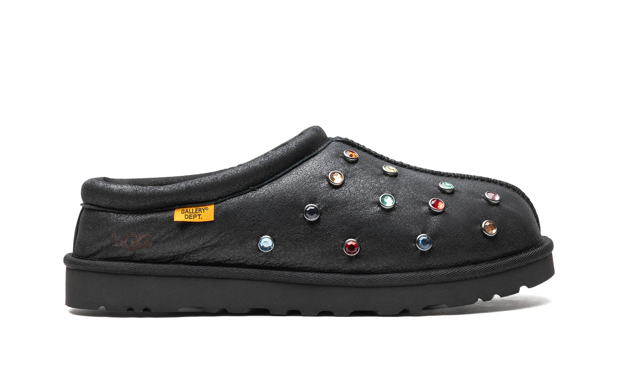 Pantoufle UGG Tasman Slipper Gallery Dept. Black en cuir noir, disponible en France, Suisse, Belgique et Luxembourg — vue de profil extérieur.